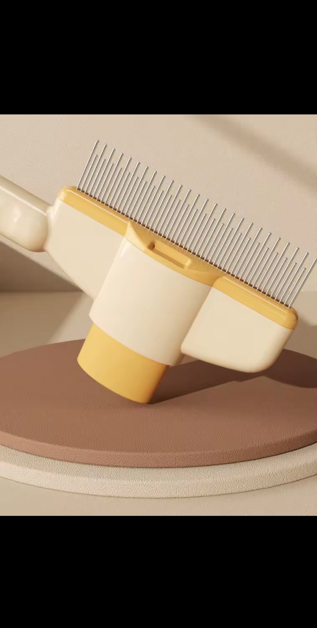 Brosse auto-nettoyante pour chiens et chats
